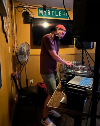 man acting as disc jockey