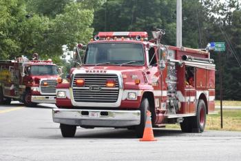 fire trucks in foreground, background