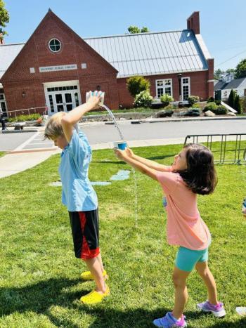 two children play a lawn game