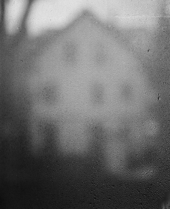 rain-blurred photo of house
