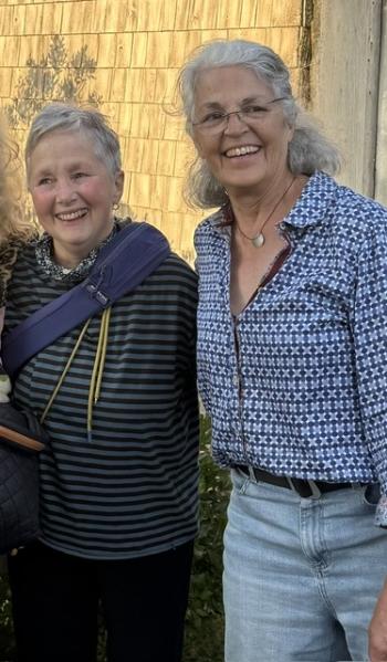two women pose for picture