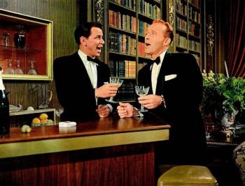 two men sing at bar