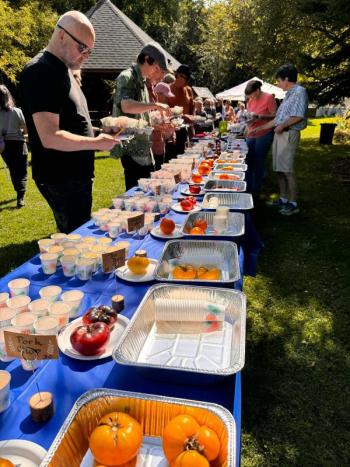 taste-testing table with male in midground