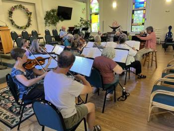 string section in rehearsal