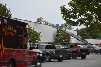 parking lot scene with ambulance, ladder truck