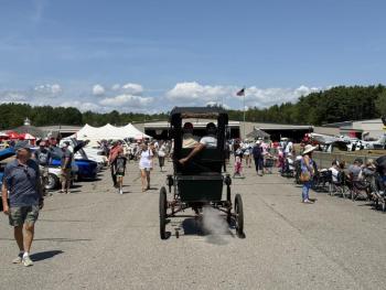 vehicle passes through festival grounds