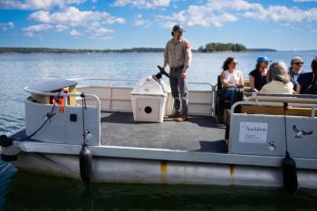 people ride in boat