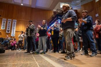 rally attendees clapping