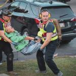 Carrying patients from the hot zone to the warm zone. (Photo courtesy Connor Howland/Camden Fire Dept.)