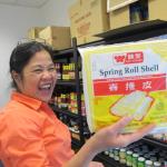 Business owner Claire Fuller displays the wrapping make up her famous Filopeno lumpia. Photo by Kay Stephens 