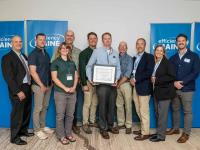 Evergreen recognized as Maine’s #1 contractor for insulation rebates by Efficiency Maine in 2025 Evergreen Home Performance team with Efficiency Maine staff at 2025 awards ceremony for top insulation rebate contractor in Maine