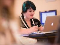 A student studying at computer