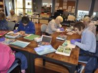 Lincoln Home residents meet monthly to create pastel paintings with Kim Traina.