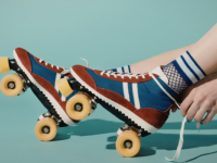 A pair of roller skates being laced up