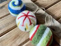 The Needle-Felted Ornaments workshop from 1:30 – 4:00 pm is for ages10 and up. During this beginner needle felting class, participants will have the option to create wool Christmas ornaments using dyed wool and premade ornament core shapes, cookie cutter ornaments, or if time allows, both types of ornaments. Class instruction includes needle care and safety precautions, wool types used, and explanation and demonstration of the needle felting process. Colors and design will be up to each student, though exam