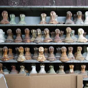 Shelves of legs for clawfoot tubs line the walls of a room in Coughlin's shop. (Photo by Ethan Andrews)