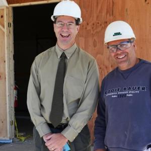 Knox County Administrator Andrew Hart stands outside 301 Park St. in Rockland with Project Supervisor Dick Beaulieu, who represents the Ganneston Construction Corporation of Augusta. (Photo by Lynda Clancy)