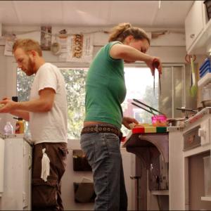 Sarah Waldron and Seth Whited, owners of Good 'n' You, side by side in the tiny kitchen.