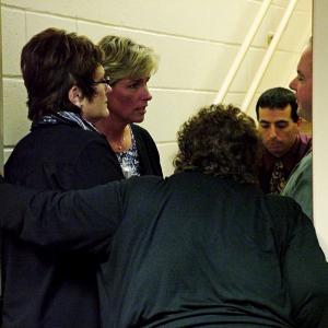 Supporters counsel Mount View Middle School teacher Eileen Ellis, second from left, during a break in a closed door session of the RSU 3 school board dealing with a grievance she filed in the spring. Ellis alleges that "bullying" by an employee ultimately forced her to take a stress-related medical leave of absence. The board heard a second grievance the same evening from teacher Ron Simmons, who cited similar treatment in his decision to switch jobs in the district. (Photo by Ethan Andrews)