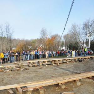 Hundreds of people showed up in Lincolnville Saturday morning, Oct. 27, to help pull the old Center School building across Route 52 to its new home on the former site of the Dean & Eugley Garage. (Photo courtesy Barbara Hatch)