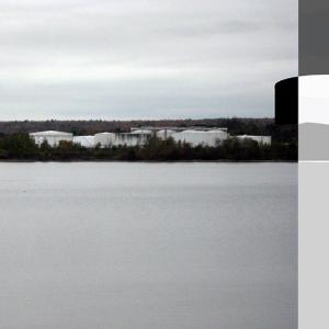 Unknowns about safety, appearance, need and collateral impact on traffic, property values and tourism have fueled controversy over the proposed construction of a 22.7 million gallon liquefied petroleum gas tank and terminal at Mack Point. (Photo illustration by Ethan Andrews)