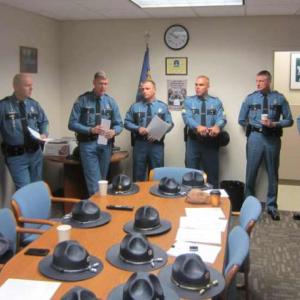 Maine State troopers and deputies will spend the eight days in New Jersey, along with troopers from Vermont and Maryland, to help restore order. Maine State Police Colonel Robert Williams, fourth from left, addresses the team.