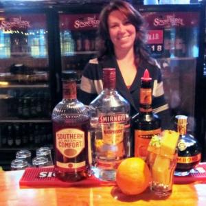 Collen Wellman, manager at The Smokestack Grill, about to prepare her signature "End Of The World" cocktail, Armageddon (photo: Kay Stephens)