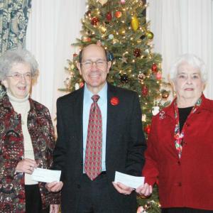 Mark Biscone, executive director of Waldo County General Hospital, is presented $6,000 in donations from Hospital Aid Treasurer Judy Whitney-Blake, left, and $3,000 from Lois Aiken, treasurer of the hospital's gift shop. (Photo courtesy Toni Mailloux)