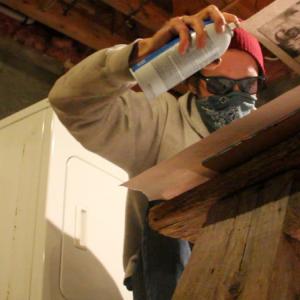 Guerrilla artist Waterdog adds some final touches to his work. (Photo by Wes Sterrs)