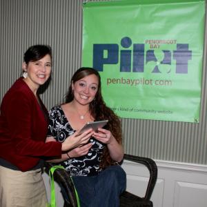 Penobscot Bay Pilot Sales Director Janis Bunting and iPad mini winner Krista Lopez-Brochu, a single mom who this winter moved into a recently completed Habitat for Humanity Home in Thomaston.