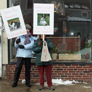 From left, Wendy Andresen and Merrill Tucker picket outside Long Grain restaurant in Camden Saturday afternoon. (Photo by Holly S. Edwards)
