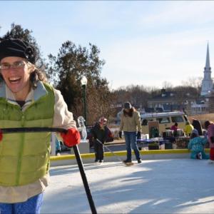 Winterfest brings out the smiles at the Camden Amphitheatre, Jan. 26. Lisa Morgan keeps the rink clean for skaters. (Photo by Lynda Clancy)