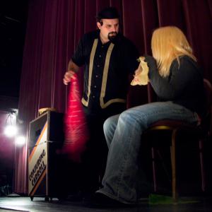 Conjuring Carroll performs magic at the Colonial Theatre with help from Lexi Richard. (Photo by Ethan Andrews) Conjuring Carroll performs a magic trick on stage at the Colonial Theatre with help from Lexi Richard. (Photo by Ethan Andrews)