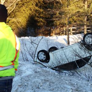 A Route 1 accident in Rockport at 3 p.m. on Thursday, Jan. 3, sent one Volkswagen beetle over a bank of snow and onto its roof. (Photo by Lynda Clancy)
