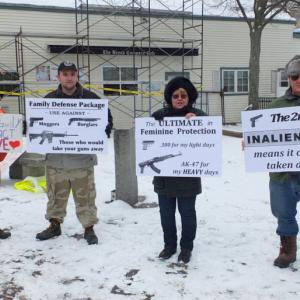 Paula Sutton, of Warren; Richard Ward Jr., of Rockland; Linda Bodnar, of Rockland; and Frank Long, of Camden, rally in support of the Second Amendment. (Photo by Chris Wolf)