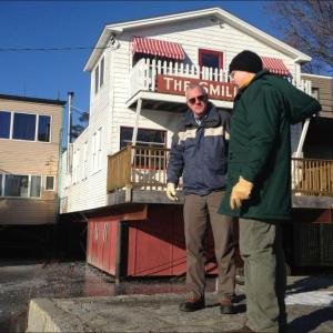 Camden's waste water treatment manager Ross Parker, and Dan Davis, oil and hazardous materials specialist with the Maine Department of Environmental Protection, discuss how to respond to the minor oil spill in Megunticook River, and its likelihood for contaminating Camden Harbor. (Photo by Lynda Clancy)