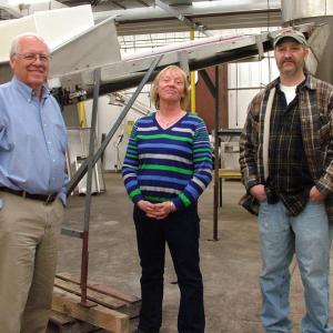 The Coastal Farms and Food Processing management team, from left, Wayne Snyder, Jan Anderson and Tony Kelly in a portion of the company's 60,000 facility that was used last fall to process over a million pounds of frozen blueberries. (Photo by Ethan Andrews)