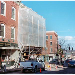 BELFAST - Scaffolding covers the front of a Main Street building owned by Maine Farmland Trust. (Photo by Ethan Andrews)