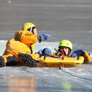 Saturday's training by Rockland Fire Department on Chickawaukie Pond involved cutting a hole in the ice and pulling a volunteer out of the frigid water, over and over again. (Photo by Holly S. Edwards)
