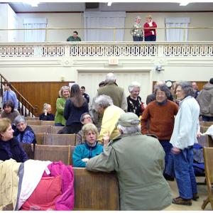 The audience in Searsport's Union Hall during a break in deliberations Wednesday night. (Photo by Ethan Andrews)