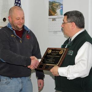 South Thomaston Fire Chief Bryan Calderwood accepts the SHAPE Award from Occupational Safety and Hazard Program Supervisor Mike LaPlante of the Maine Department of Labor. (Photo by Holly S. Edwards)