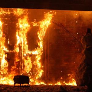 A snowman, built by Lincolnville firefighters Brandon Allen, Orin Todd and Nathaniel Boehmer, following training evolutions Sunday afternoon, appears to be waving goodbye to the former Lotus Restaurant on Route 1 in Camden as it burns to the ground at the request of property owner Hannaford Supermarkets. (Photo by Holly S. Edwards)