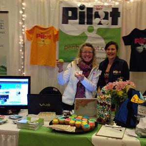 Holly S. Edwards and Janis Bunting at the Penobscot Bay Pilot booth at the Penobscot Bay Regional Chamber of Commerce Business and Community Expo in Rockport today. (Photo by Lynda Clancy)