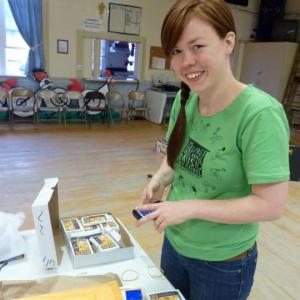 Belfast Free Range Music Festival organizer Meg Fournier working in the American Legion Hall before the event in 2011. (Photo by Kristen Burkholder)