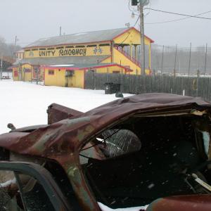 A smashed and rusted car outside the Unity Raceway grandstands on March 4. The track closed last August due to financial troubles but was recently leased by Last Chance Motorsports. The Washburn-based company plans to reopen the track in May. (Photo by Ethan Andrews) A smashed and rusted car outside the Unity Raceway grandstands on March 4. The track closed last August due to financial troubles but was recently leased by Last Chance Motorsports. The Washburn-based company plans to reopen the track in May. (Photo by Ethan Andrews)