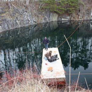 Dallas Fields and Ben Bruno use underwater camera equipment to try and locate a car submerged in Eells Quarry on Main Street, near Annis Lane, in Rockport Tuesday. (Photo by Holly S. Edwards)