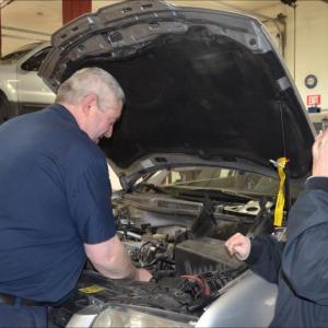 Eric and Jan Campbell, new owners of Rockport Automotive. While Eric works on the vehicles, Jan works the phones, and the business. (Photo by Lynda Clancy)