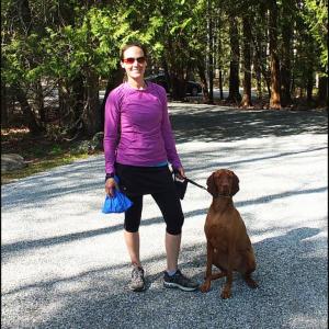 Cheryl Lezin of Warren with her dog Trapper at the Children's Chapel 
