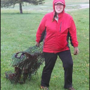 Vanessa Richards drags a lobster trap she found on the beach. 