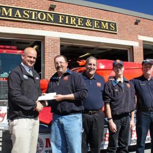 From left, Maine Lobster Festival Board President Tim Carroll, Thomaston Fire Capt. Tony Leo, Chief Mike Leo, and firefighters Sean Goodine and Floyd Lawrence. (Photo by Holly S. Edwards)